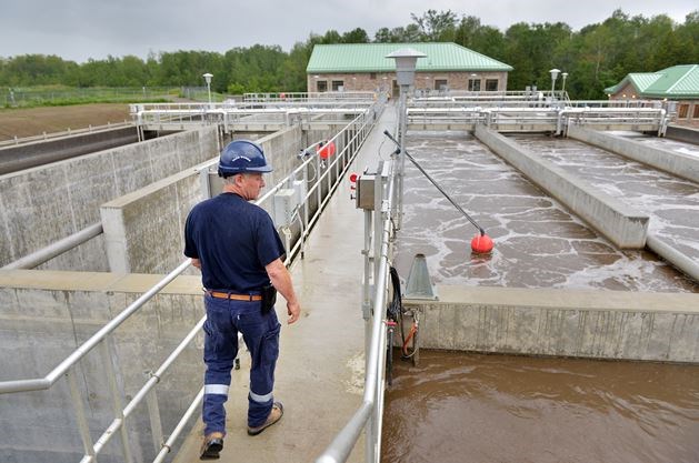 A picture of a man at a wastewater facility