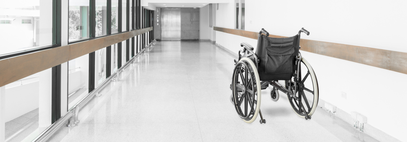 Wheelchair in the hallway of a health care facility.