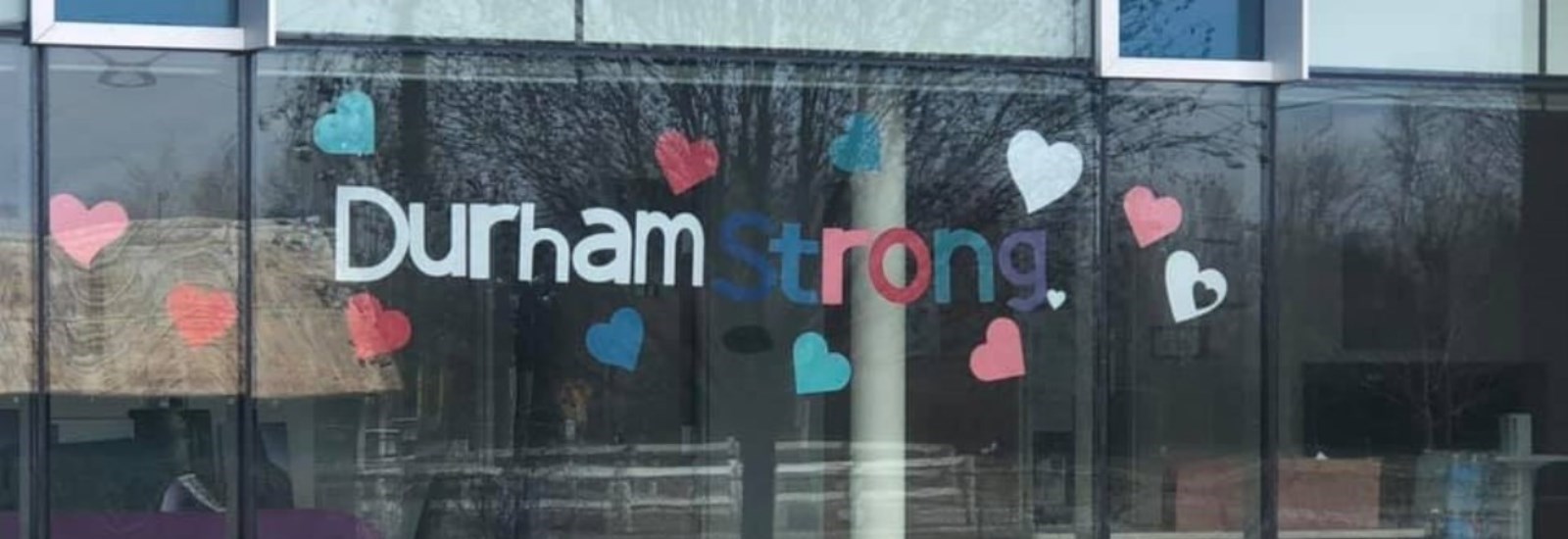 Durham Strong sign in Lakeview Manor window