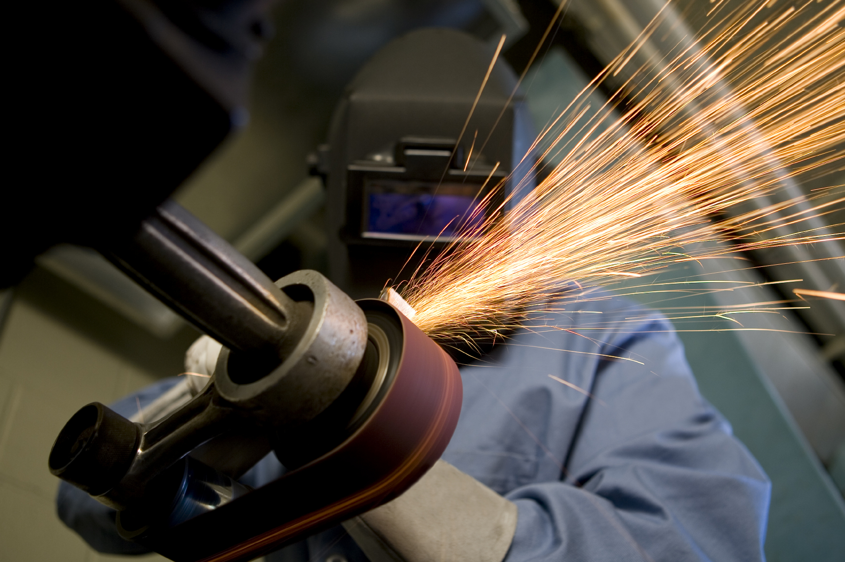 A picture of someone working with a power grinder