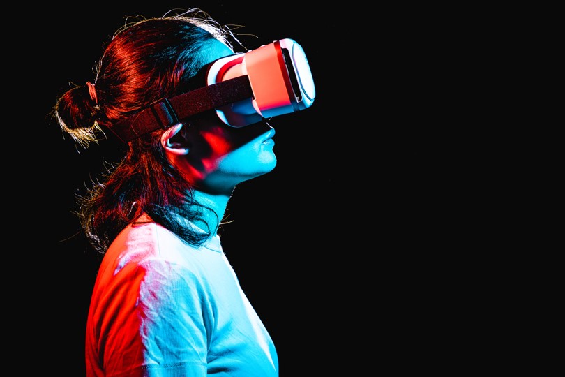 A picture of a woman wearing a VR headset