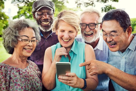 A picture of seniors looking at a phone