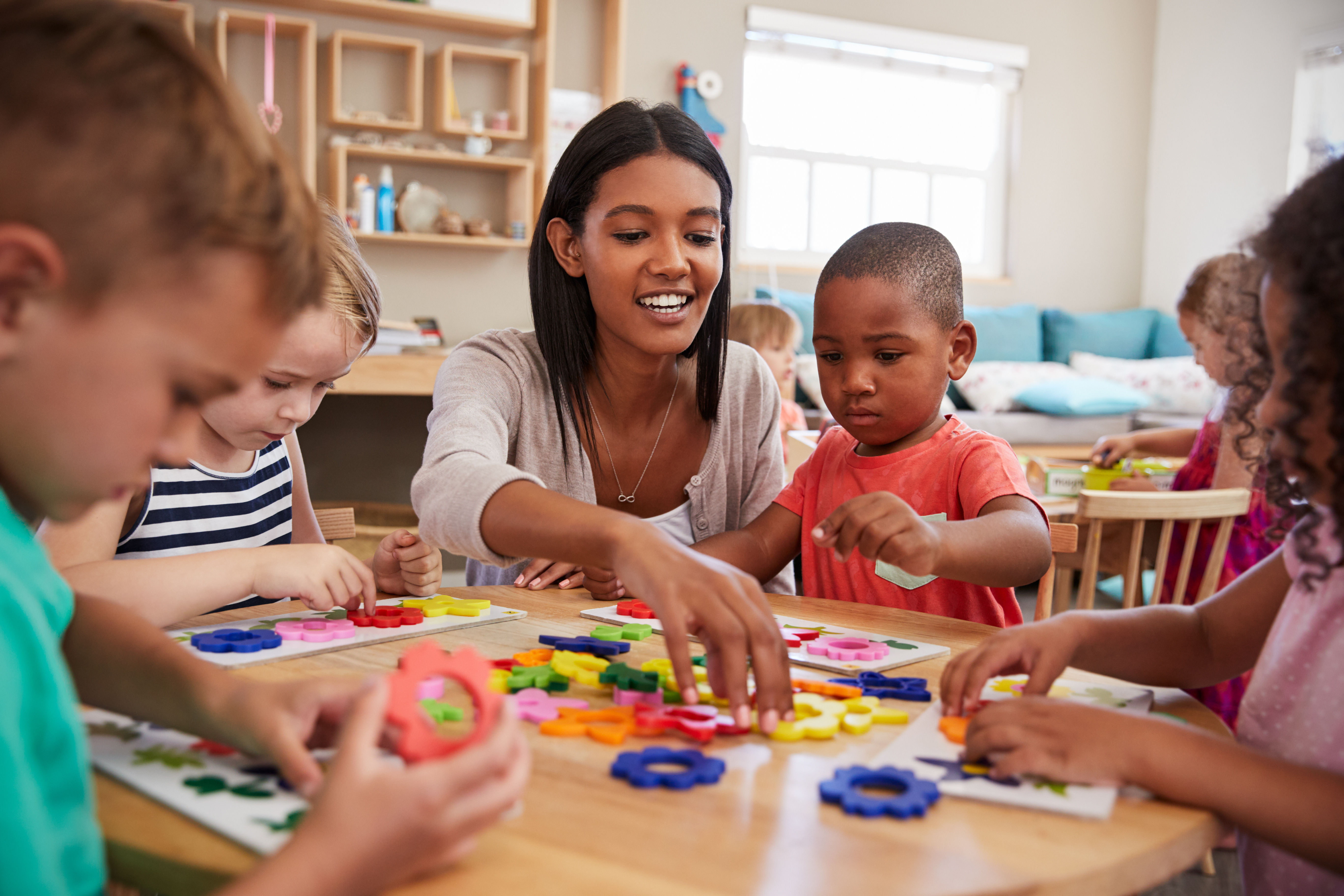 A picture of an educator with a group of children