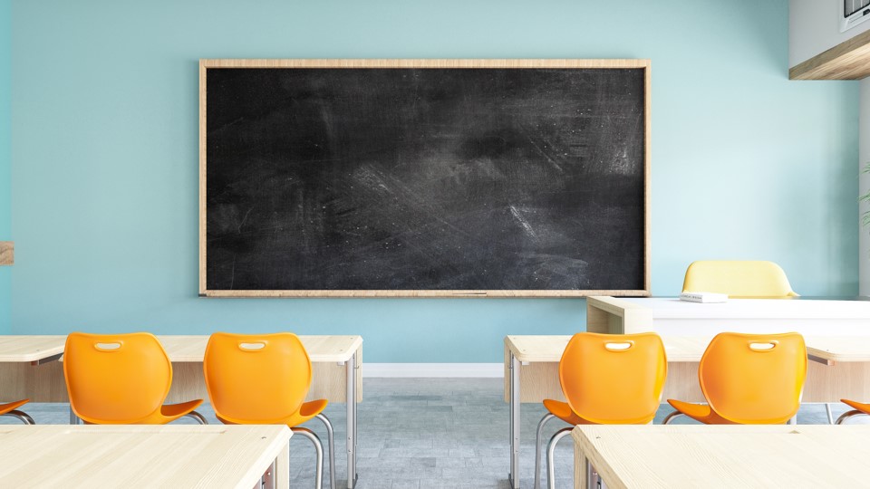 school desk chairs and chalkboard
