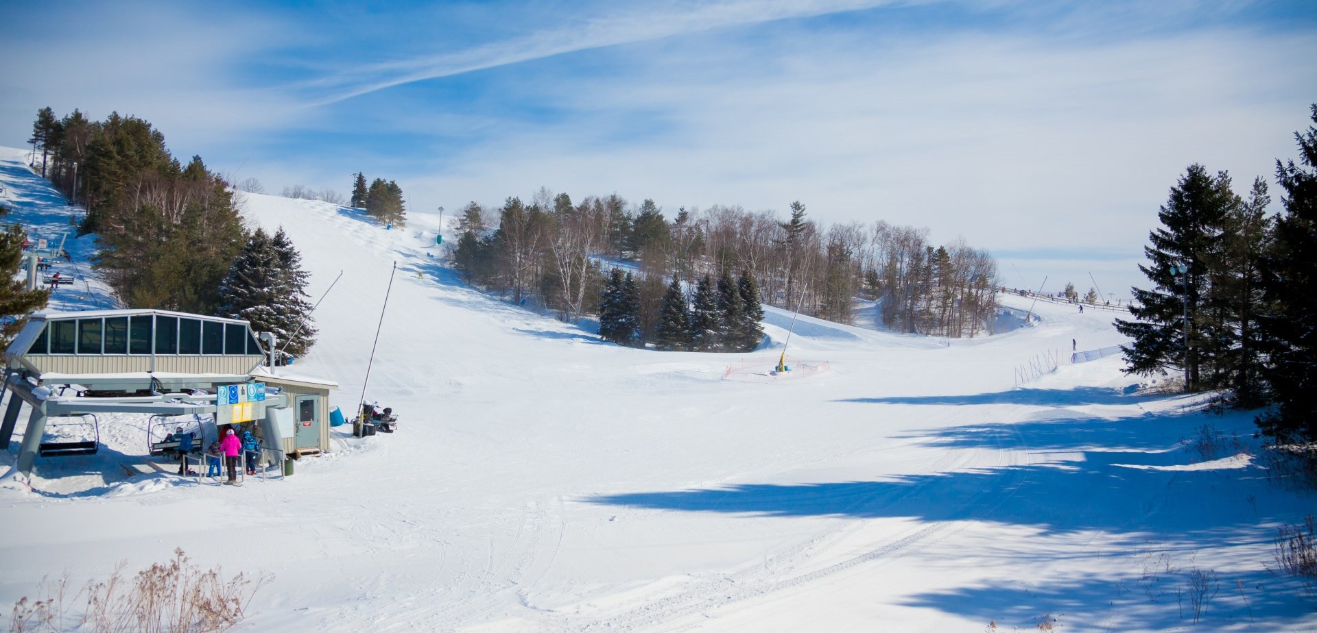 Long shot of ski hill at Lakeridge Ski Resort with chair lift off to the side