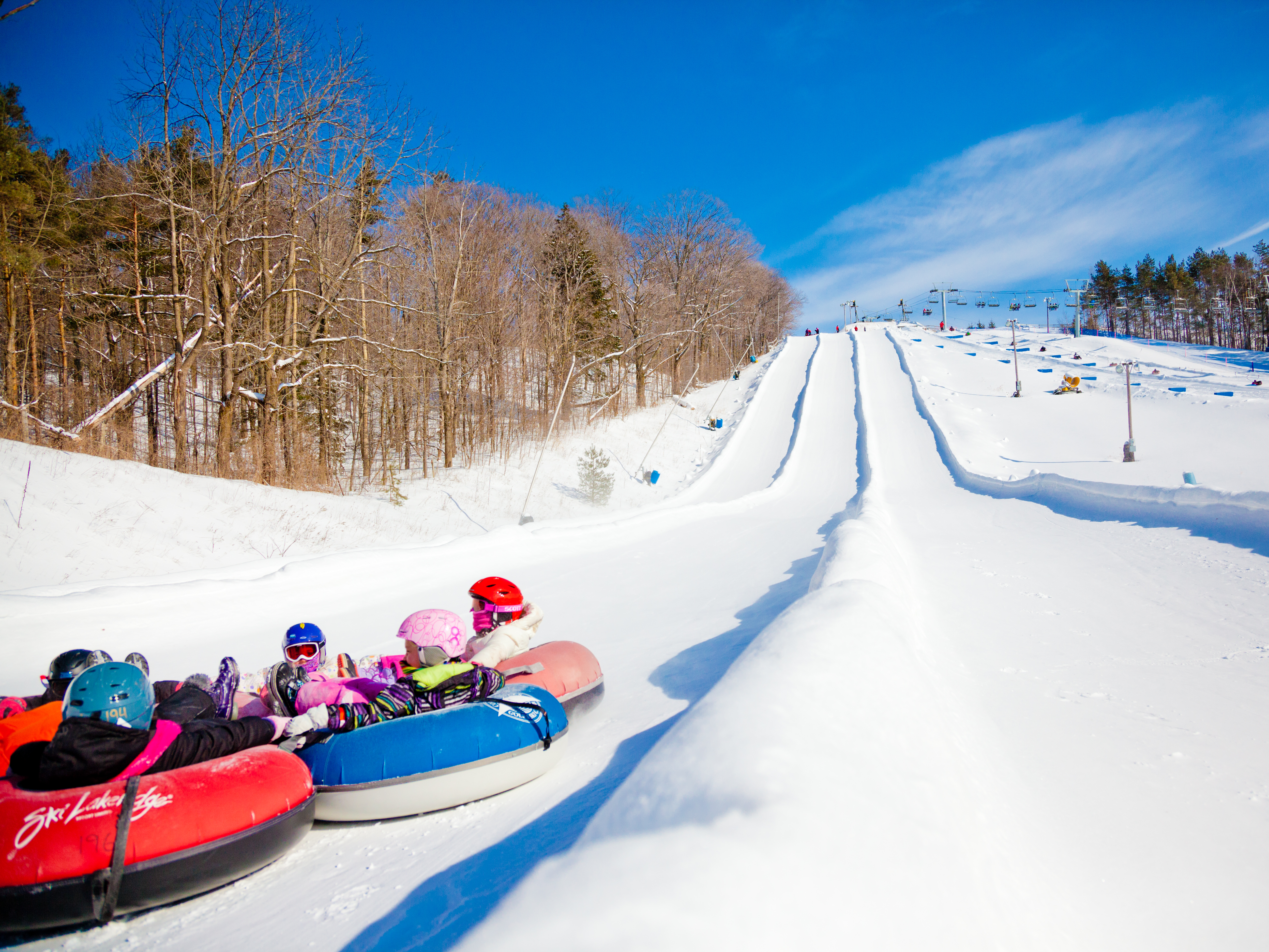Kids at the bottom of a snowtubing hill at Lakeridge Ski Resort