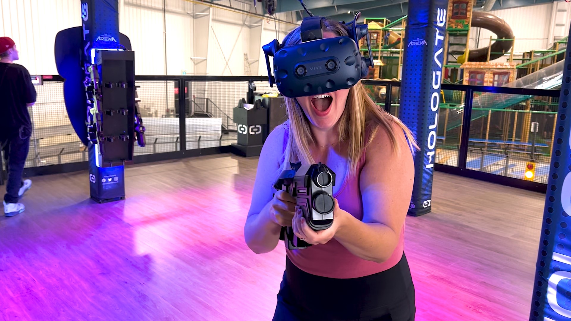 Woman with VR headset on playing game
