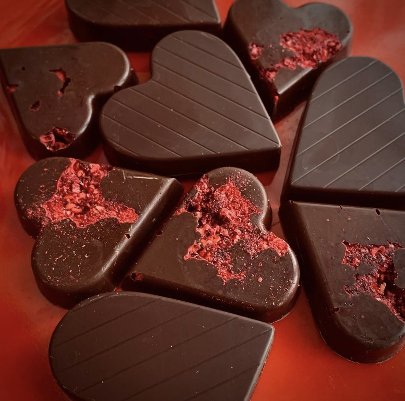 Chocolate hearts on a red background