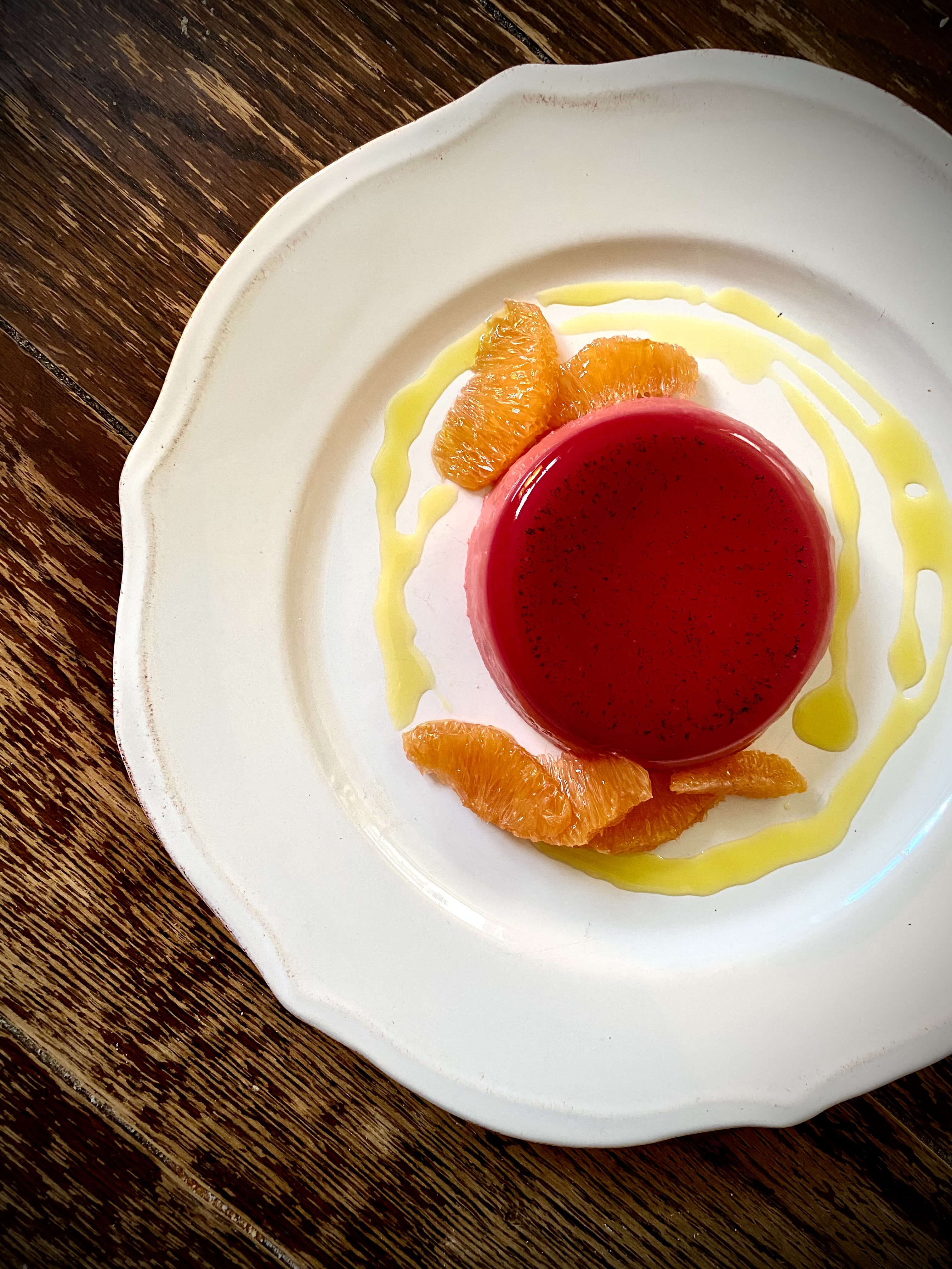 Beet, buttermilk and maple lavender panna cotta on a white plate