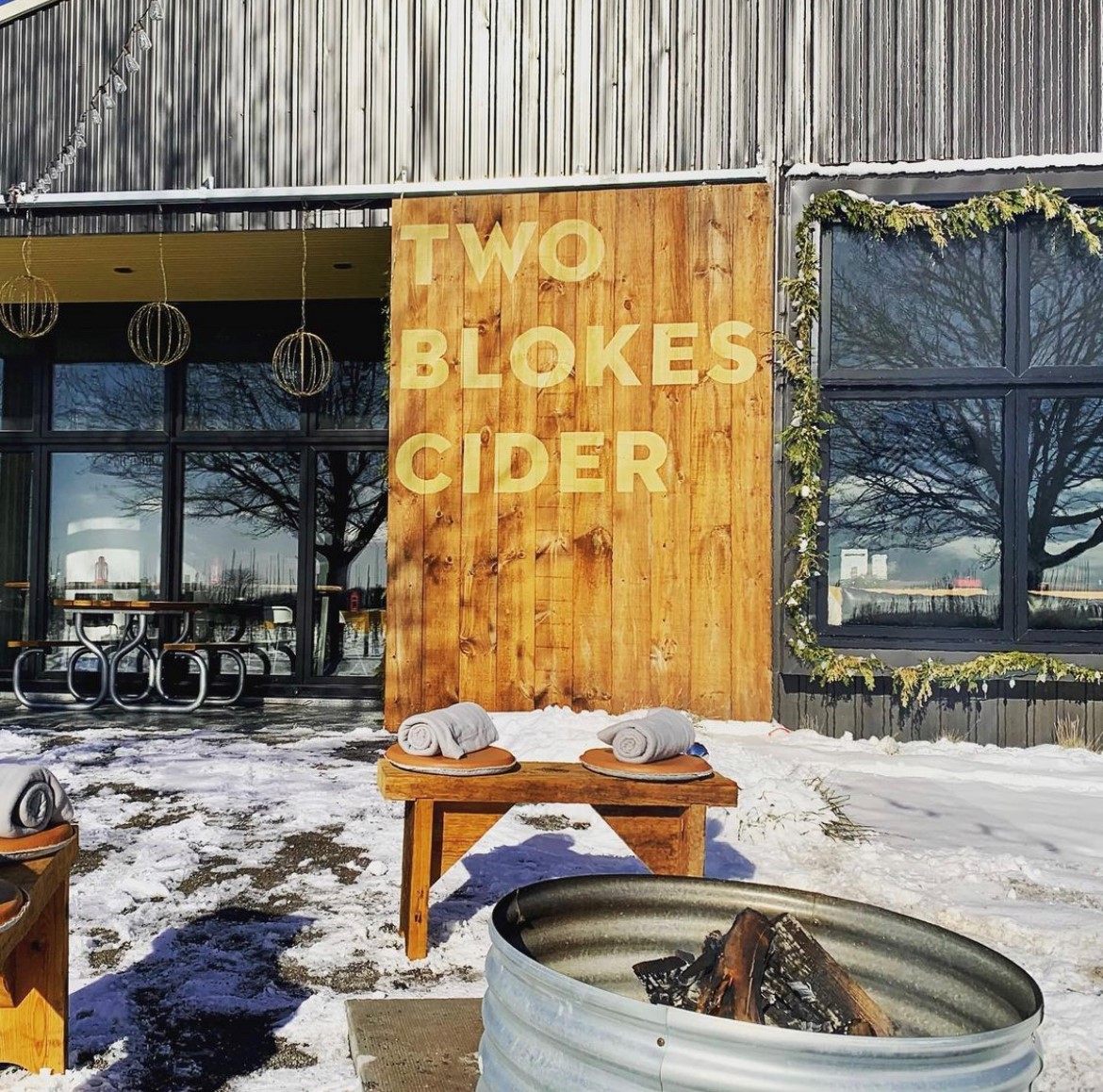 Two Blokes Cider shop with fir pit and seating outside