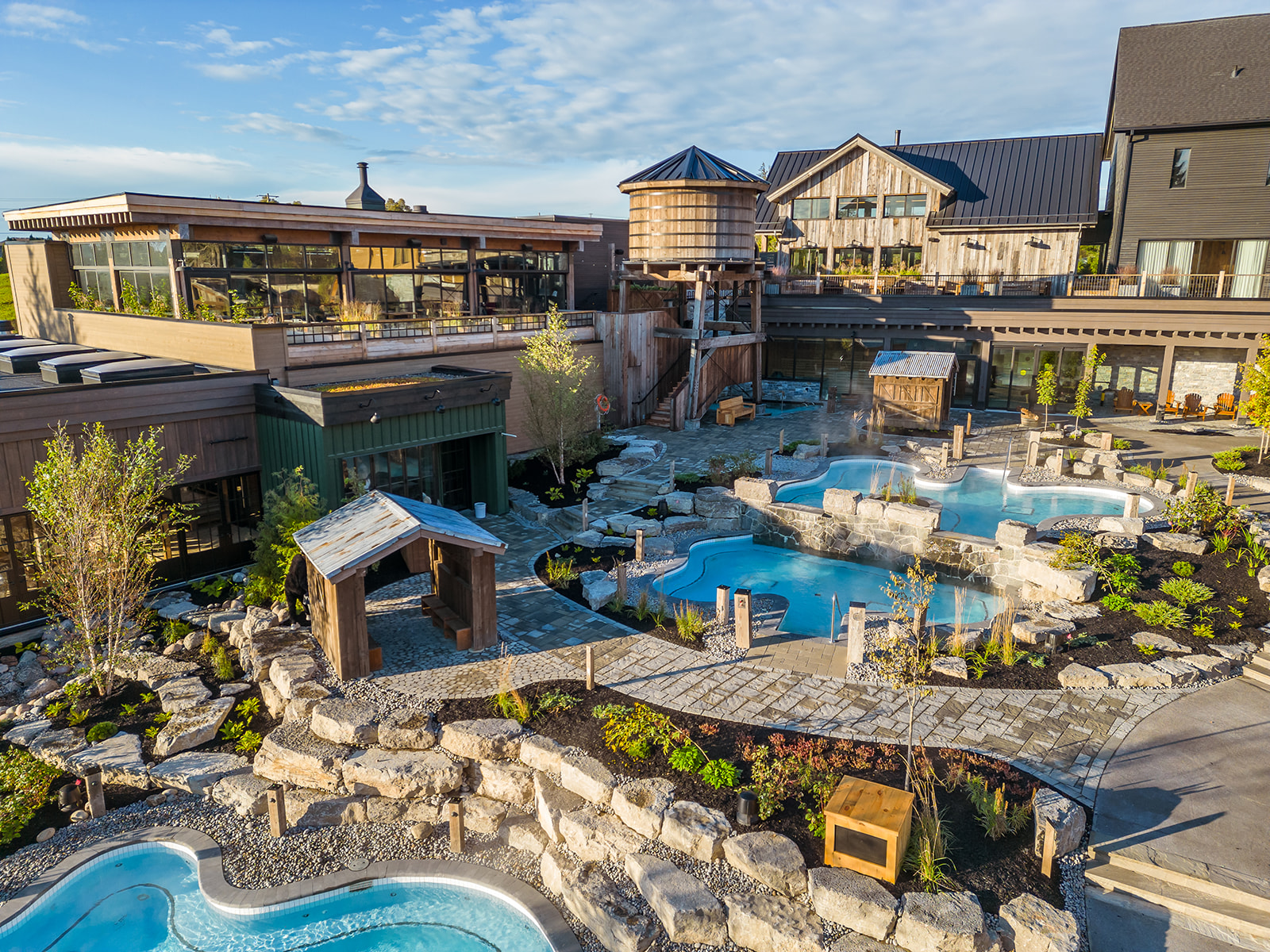 Image of Thermea spa village in Whitby that shows water tower, walkways, outdoor baths and rest areas