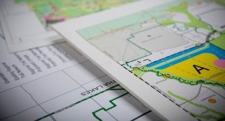 Maps of Durham Region on a table