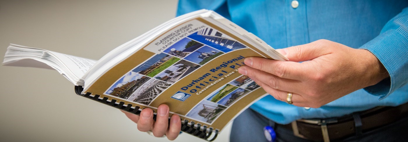 Man reading copy of Regional Official Plan