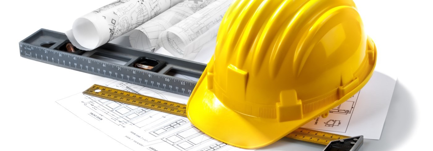 Hard hat with drawings on table