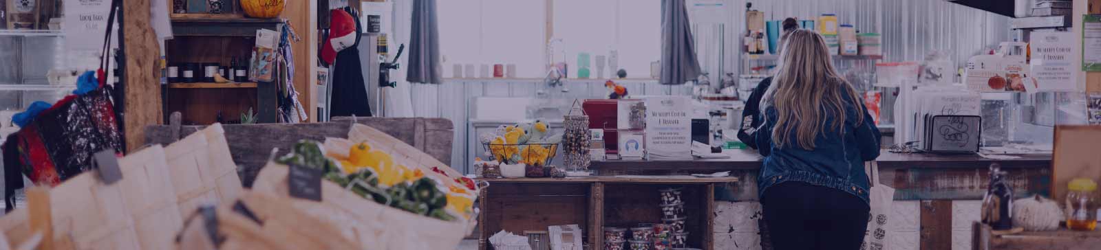 Woman at the front counter at an on-farm market.