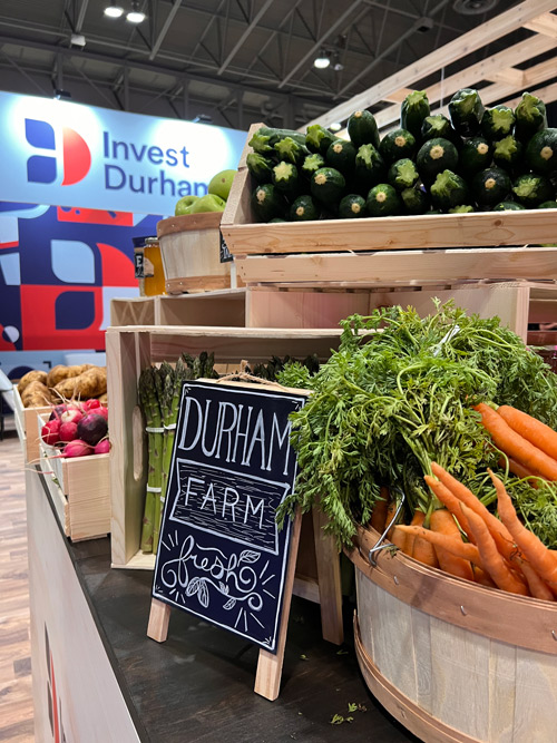 Close op of the farmers' market display with a sign that reads, "Durham Farm Fresh"."