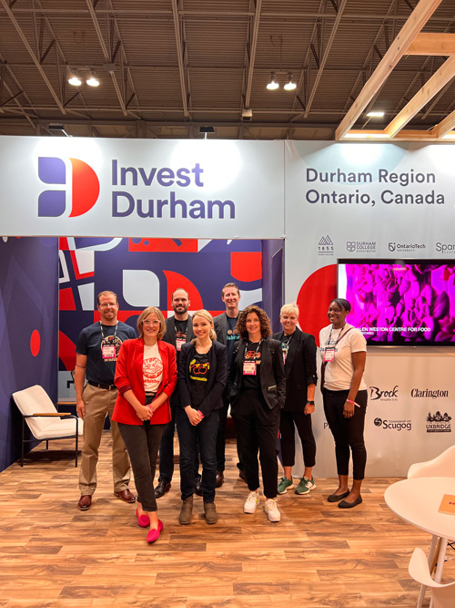 Durham at Collision team photo at the Invest Durham booth.