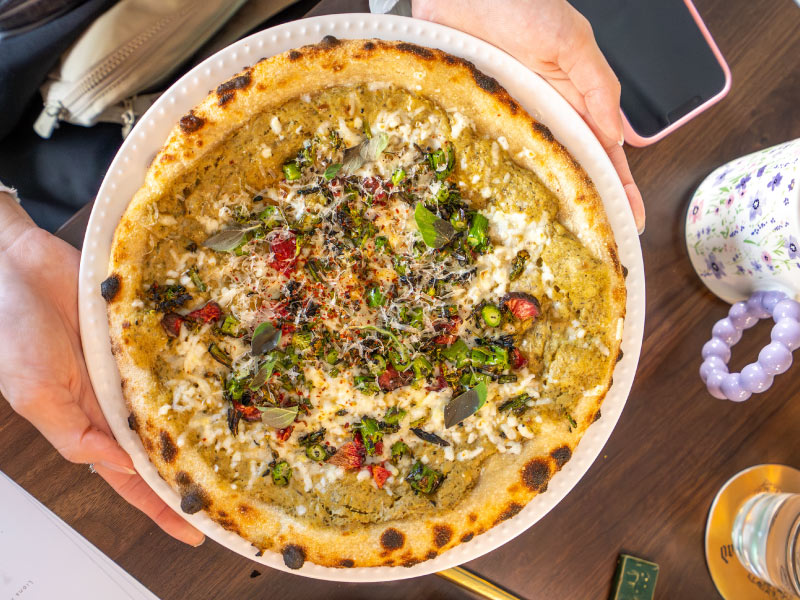 Overhead shot of an upscale pizza.
