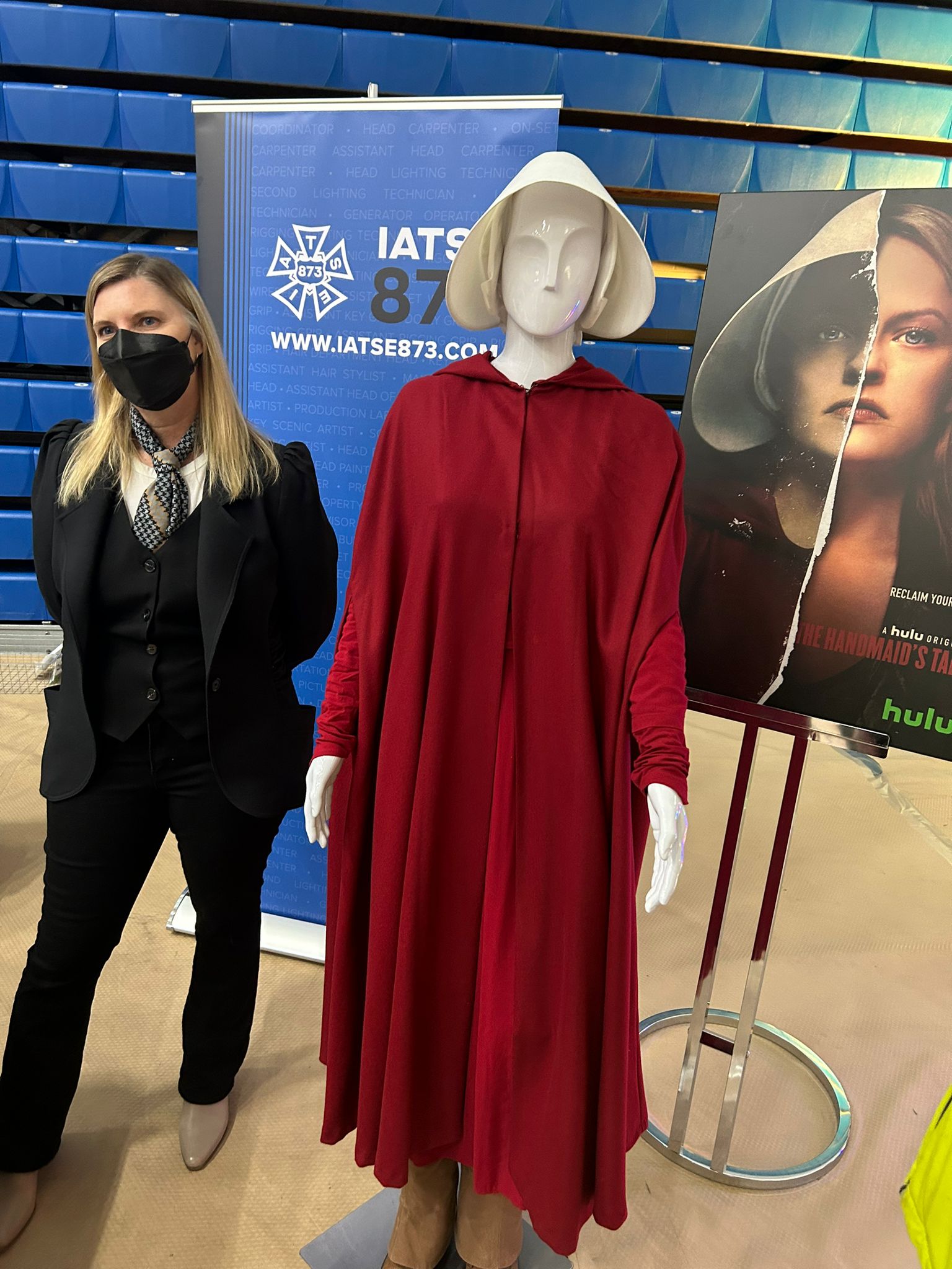 A mannequin wearing a red handmaids costume from The Handmaid's Tale.