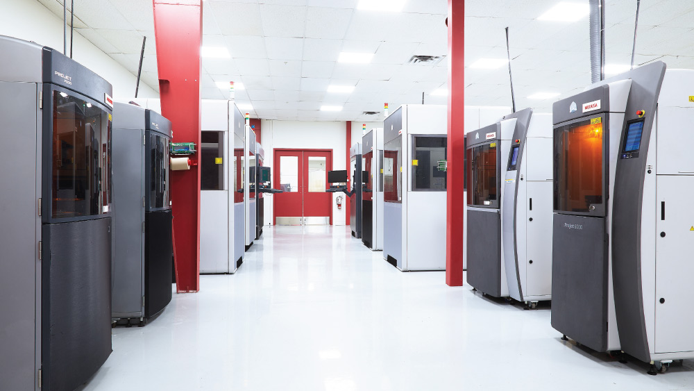 3D printers in a white, modern space at Agile Manufacturing.