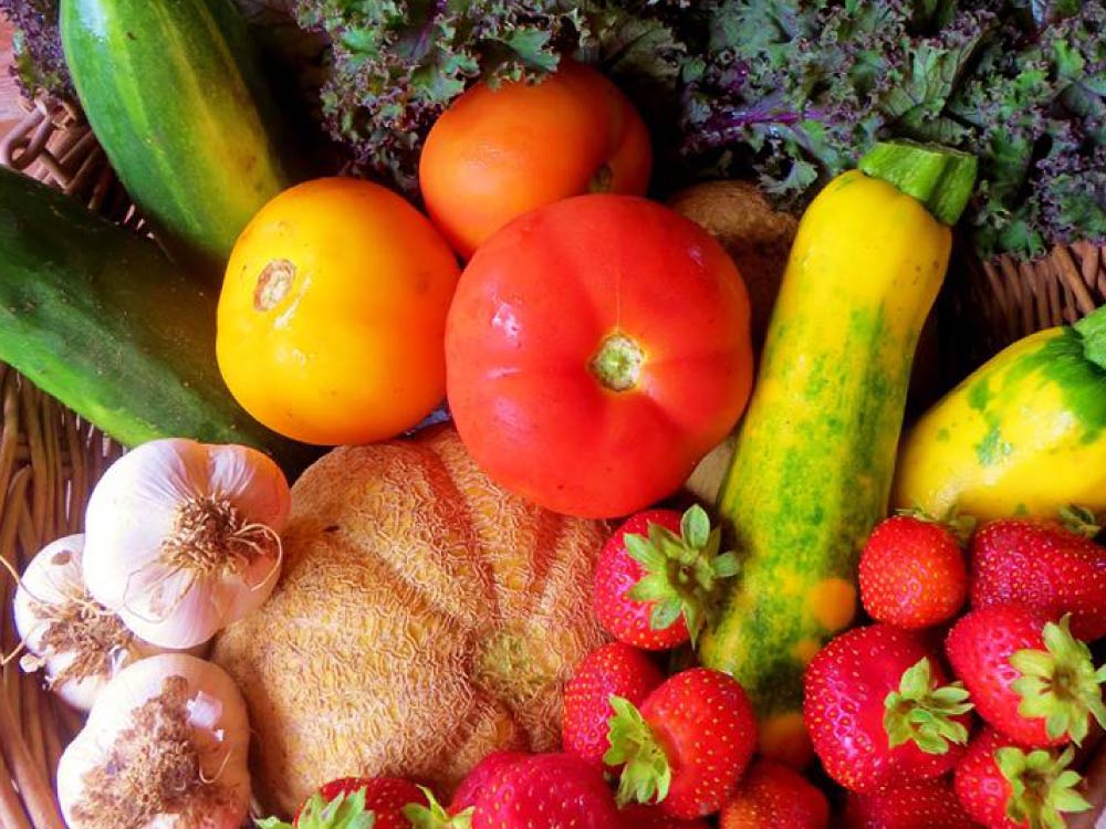 Close up of a variety of brightly coloured vegetables.