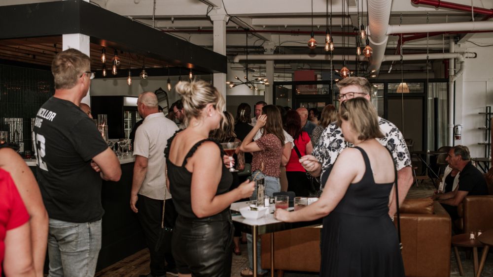 Crowd of people enjoying an event at The Wellington Lofts in Bowmanville, Ontario, Canada