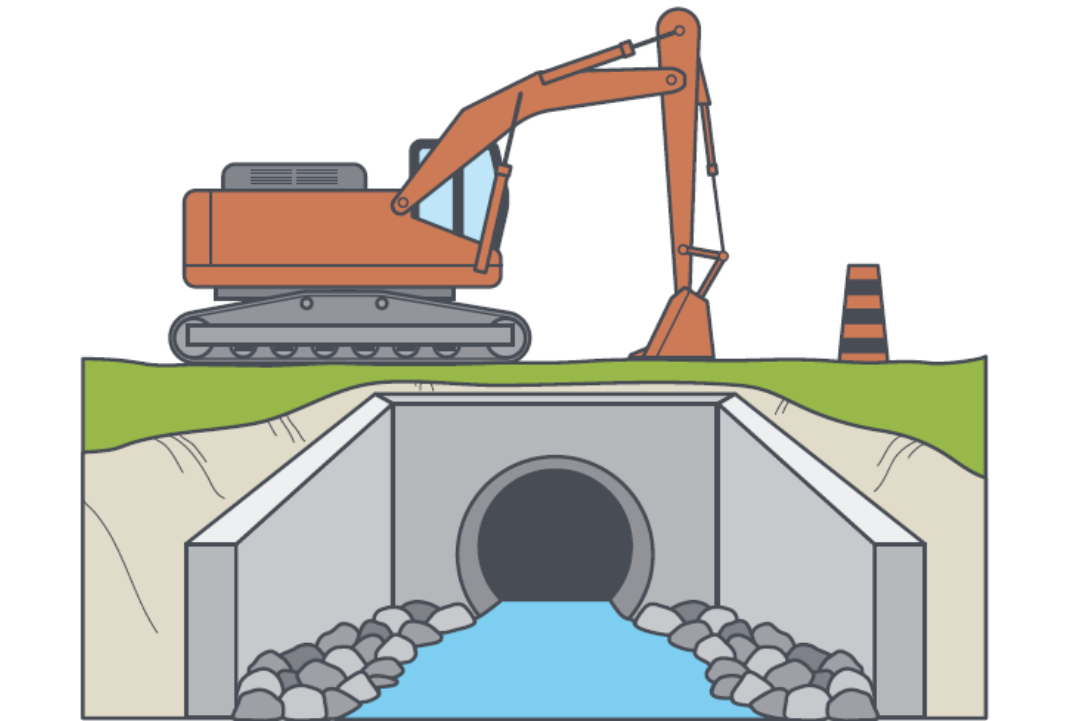 Construction equipment sits above a culvert with water in it