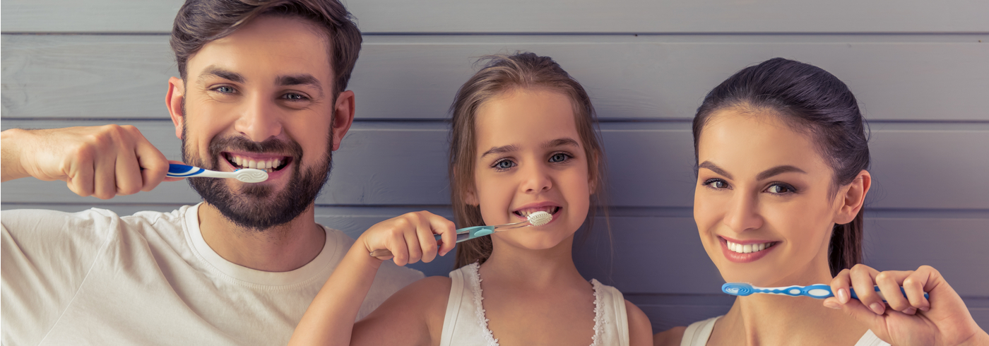 Family brushing their teeth.