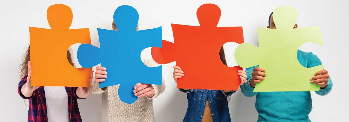 Students holding puzzles