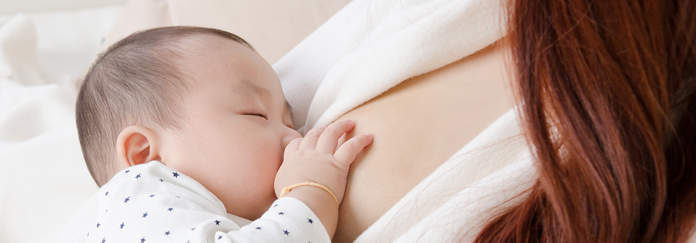 A mother breastfeeding her baby.