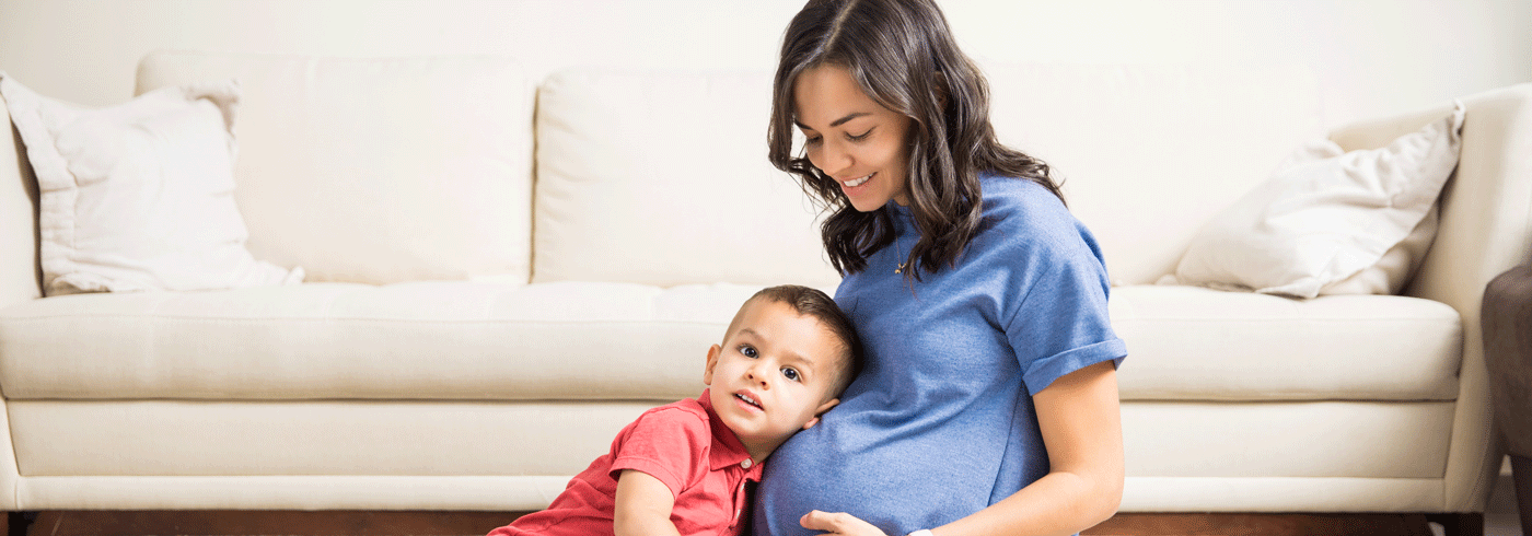 Pregnant mother with young child.