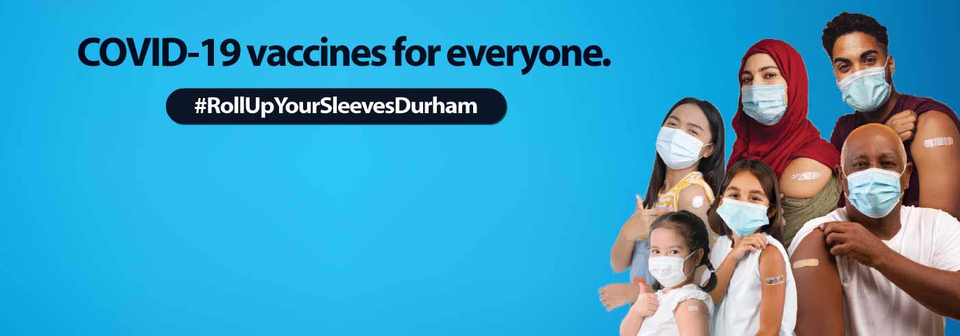 Group of people rolling up their sleeves.