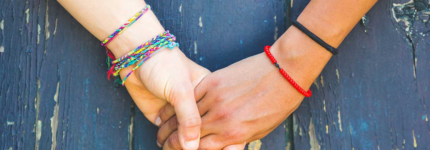 Two people holding hands.