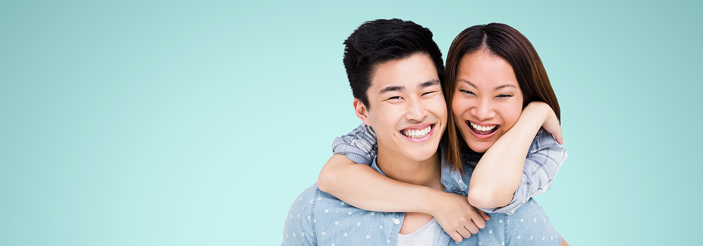 Young couple smiling.