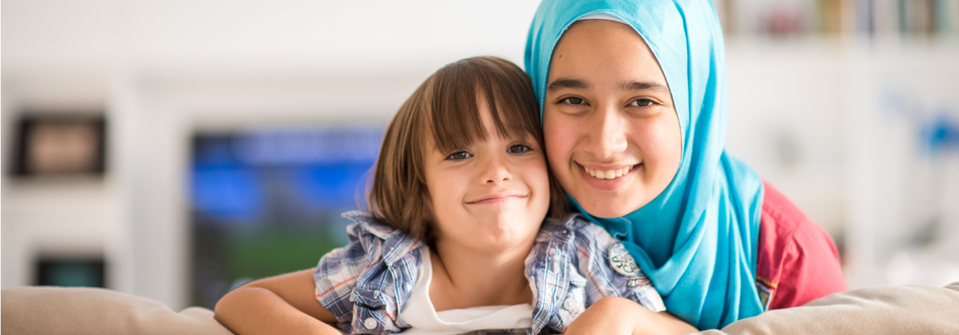 Mother and daughter smiling.