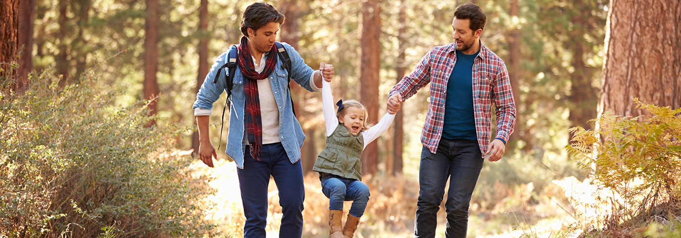 Family walking in the woods.