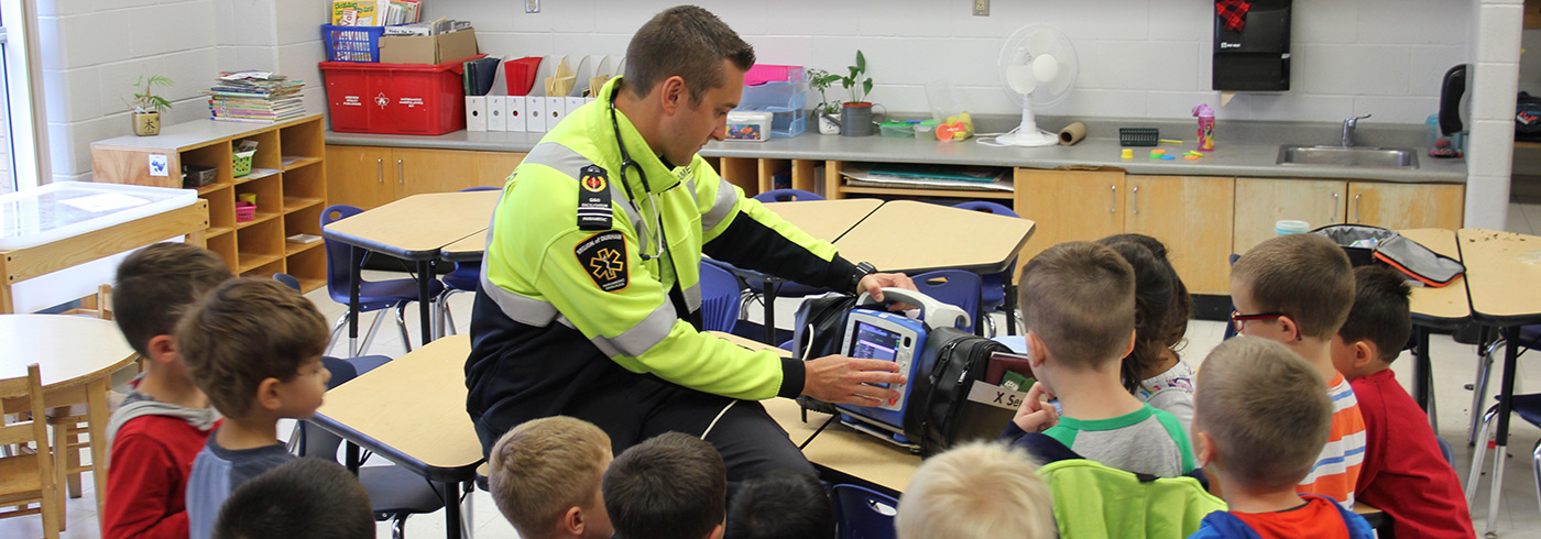 Durham Region paramedic educating a children at school.