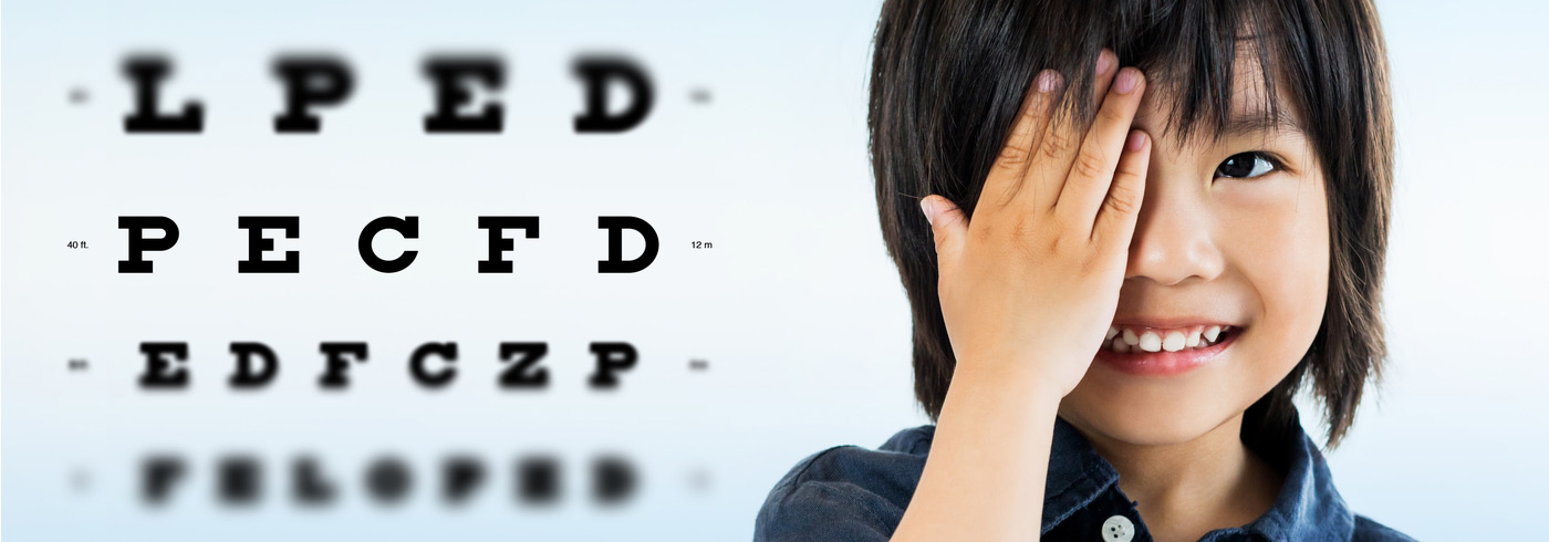 Little boy doing eye test.