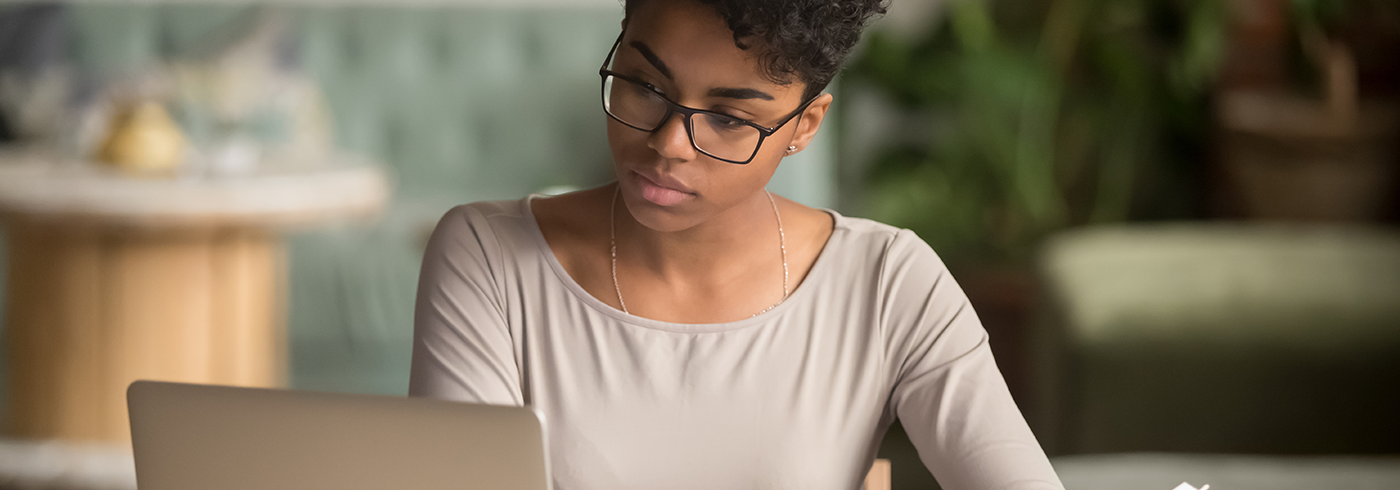 Female with book and laptop