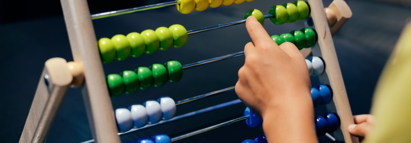 Child counting beads