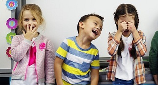 A group of children laughing together