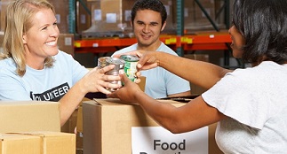 Volunteers work together to pack food at a food bank