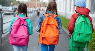Kids walking to school with their school bags