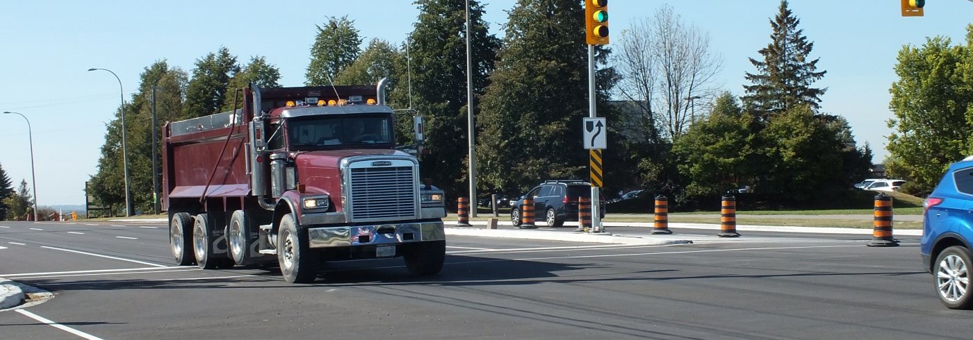 Big red truck going through intersection