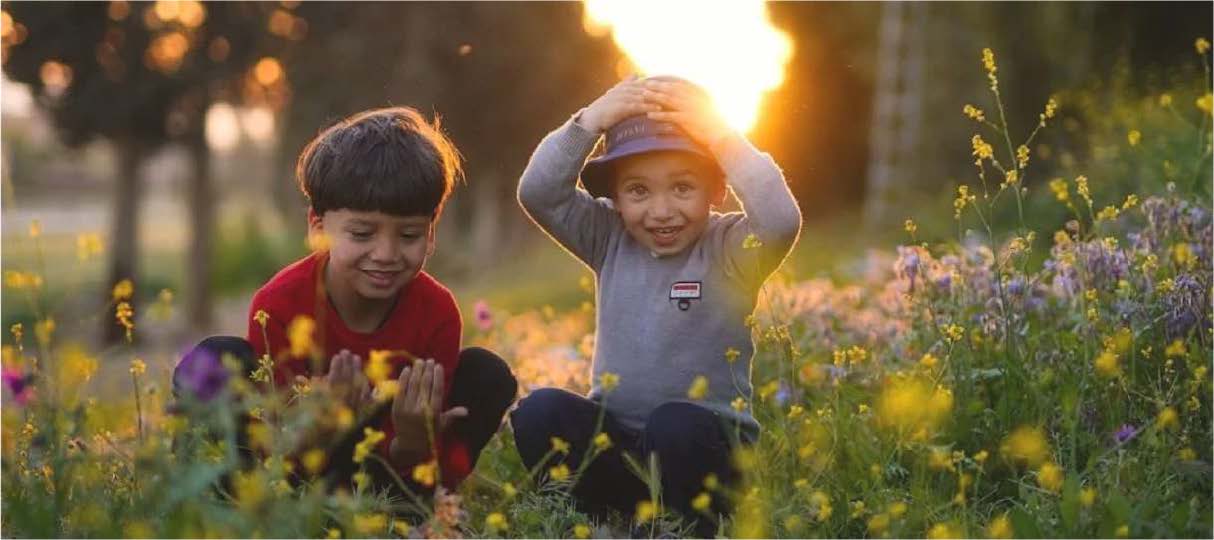 Children playing in the grass