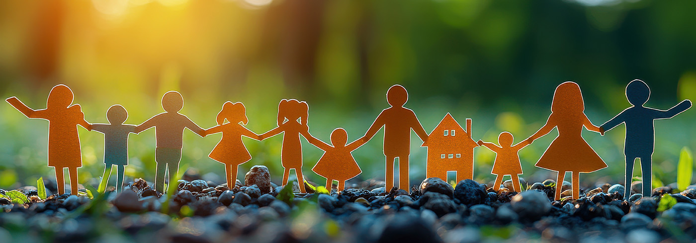 Paper cutout of people holding hands