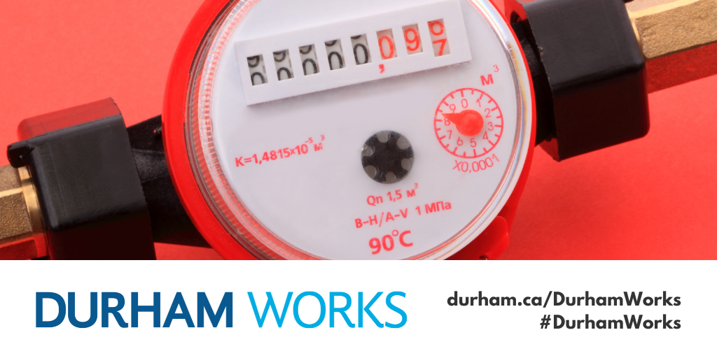 A photo of a water meter with a red background with a designed Durham Works logo and text reading durham.ca/DurhamWorks #DurhamWorks