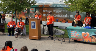 Members of the community gathering at the Region of Durham Headquarters to hear speakers, before embarking on the Truth and Reconciliation Awareness Walk.