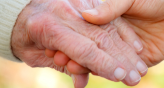 Elderly hand holding