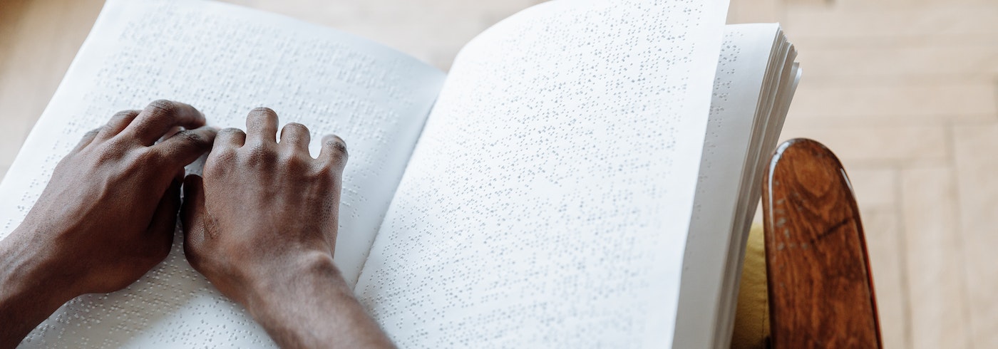Person reading braille